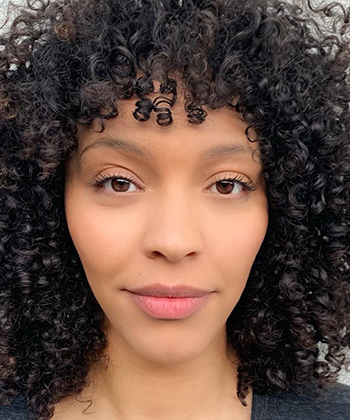 How to Cut and Style Curly Bangs, According to a Stylist